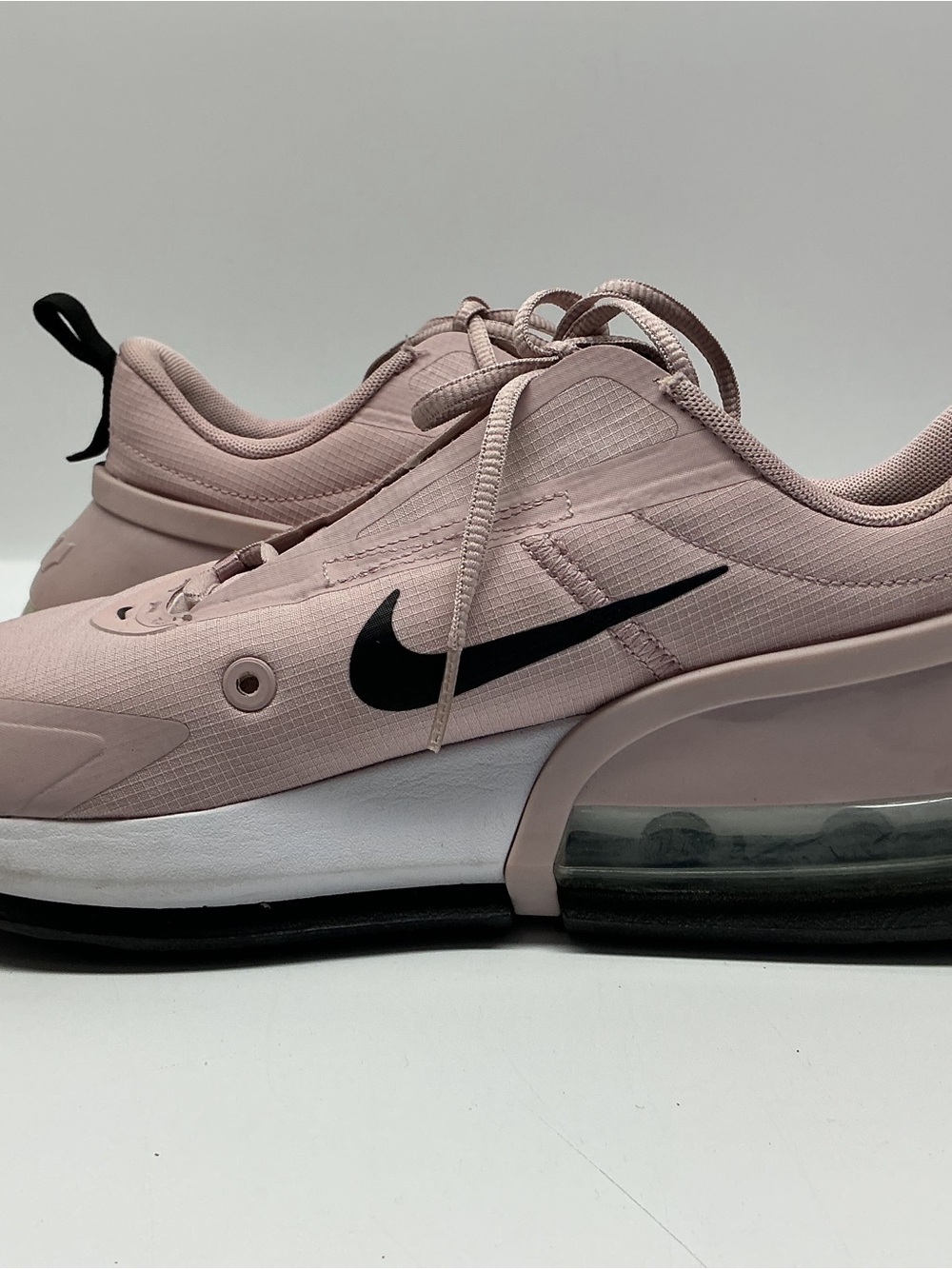 Nike Women's Blush Pink Sneakers with Black Swoosh